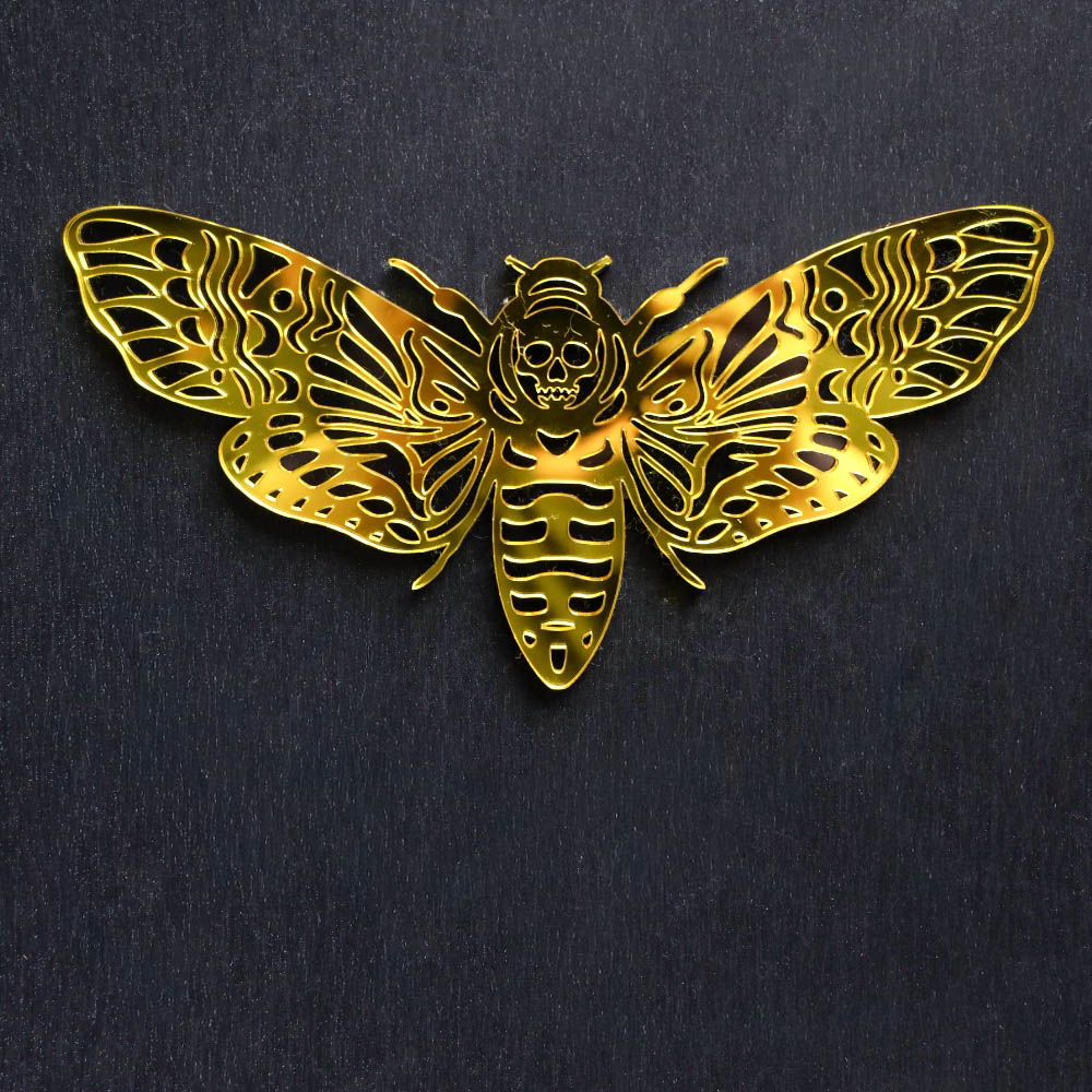 Death Moth Yellow Mirror Sign. This sign is made with black acrylic base and a yellow mirror top layer. Comes with attachable keyhole.