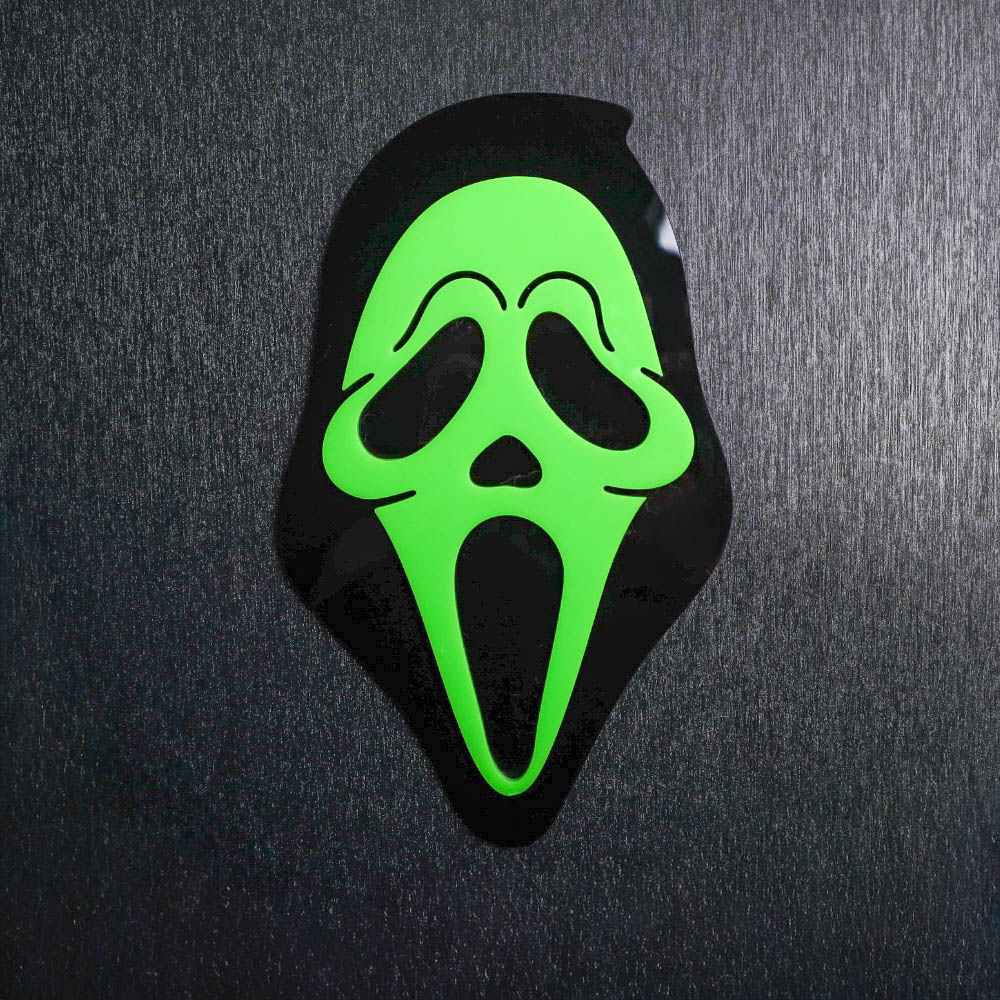 Ghostface Green Sign. This sign is made with black acrylic base and a neon green acrylic topper. Comes with attachable keyhole.