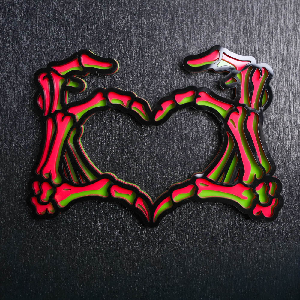 Skeleton Hands Neon Sign. This sign is made with neon green acrylic base, hot pink acrylic center, and a black acrylic topper. Comes with attachable keyhole.