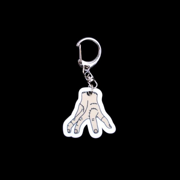 Thing Bag Tag. This bag tag is made with acrylic and heat pressed. Comes with lobster clasp topper that easily hooks to a bag, zippers, and lanyards for fun display and swivels. White backside.