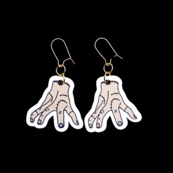 Thing Earrings. These earrings are made with acrylic and hand heat pressed. Comes with 18k plated gold hooks that is nickel free. Easily put loop through ear and hook back so the earring doesn’t fall out.