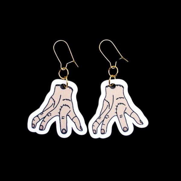 Thing Earrings. These earrings are made with acrylic and hand heat pressed. Comes with 18k plated gold hooks that is nickel free. Easily put loop through ear and hook back so the earring doesn’t fall out.