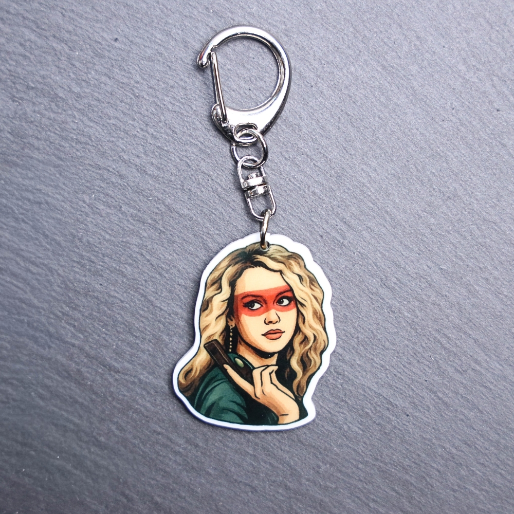 80's Killer Chick Bag Tag. This bag tag is made with acrylic and heat pressed. Comes with lobster clasp topper that easily hooks to a bag, zippers, and lanyards for fun display and swivels. White backside.