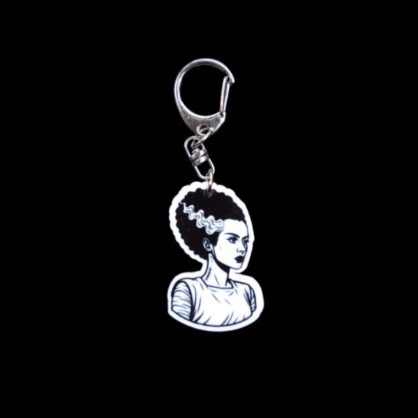Bride Bag Tag. This bag tag is made with acrylic and heat pressed. Comes with lobster clasp topper that easily hooks to a bag, zippers, and lanyards for fun display and swivels. White backside.