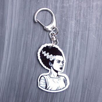 Bride Bag Tag. This bag tag is made with acrylic and heat pressed. Comes with lobster clasp topper that easily hooks to a bag, zippers, and lanyards for fun display and swivels. White backside.