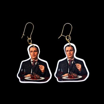 Chesapeake Ripper Eats Earrings. These earrings are made with acrylic and hand heat pressed. Comes with 18k plated gold hooks that is nickel free. Easily put loop through ear and hook back so the earring doesn’t fall out.