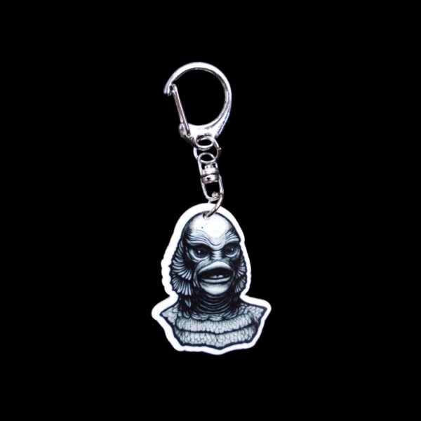 Creature Bag Tag. This bag tag is made with acrylic and heat pressed. Comes with lobster clasp topper that easily hooks to a bag, zippers, and lanyards for fun display and swivels. White backside.
