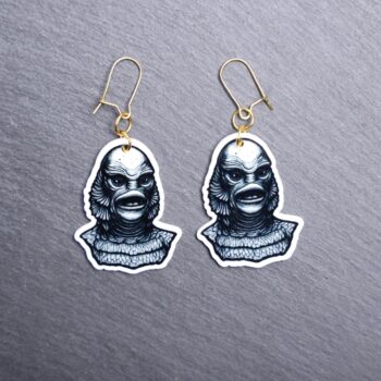 Creature Earrings. These earrings are made with acrylic and hand heat pressed. Comes with 18k plated gold hooks that is nickel free. Easily put loop through ear and hook back so the earring doesn’t fall out.