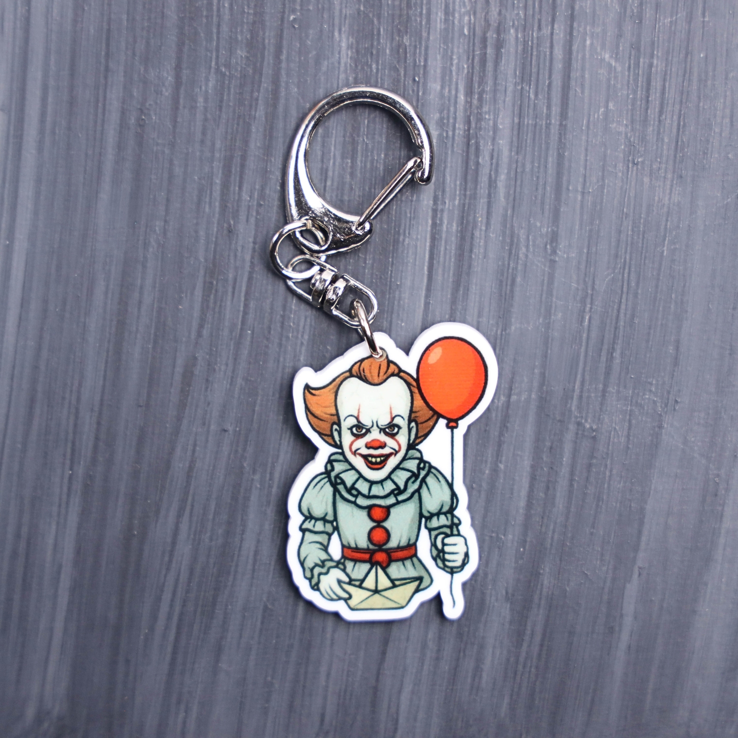 Dancing Clown Bag Tag. This bag tag is made with acrylic and heat pressed. Comes with lobster clasp topper that easily hooks to a bag, zippers, and lanyards for fun display and swivels. White backside.