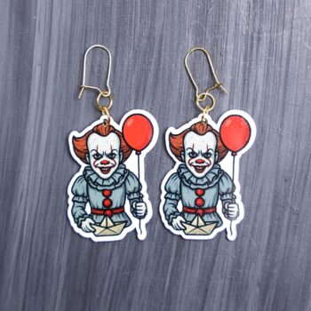 Dancing Clown Earrings. These earrings are made with acrylic and hand heat pressed. Comes with 18k plated gold hooks that is nickel free. Easily put loop through ear and hook back so the earring doesn’t fall out.