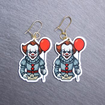 Dancing Clown Earrings. These earrings are made with acrylic and hand heat pressed. Comes with 18k plated gold hooks that is nickel free. Easily put loop through ear and hook back so the earring doesn’t fall out.