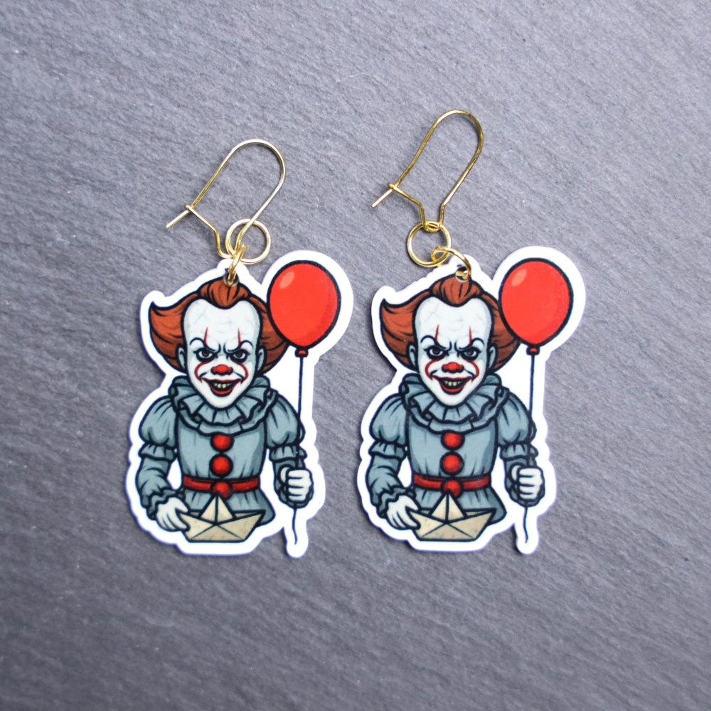 Dancing Clown Earrings. These earrings are made with acrylic and hand heat pressed. Comes with 18k plated gold hooks that is nickel free. Easily put loop through ear and hook back so the earring doesn’t fall out.