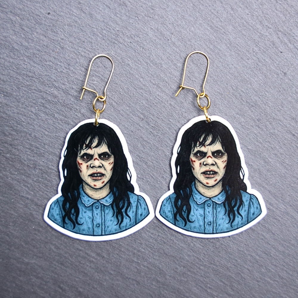 Demon Girl Earrings. These earrings are made with acrylic and hand heat pressed. Comes with 18k plated gold hooks that is nickel free. Easily put loop through ear and hook back so the earring doesn’t fall out.