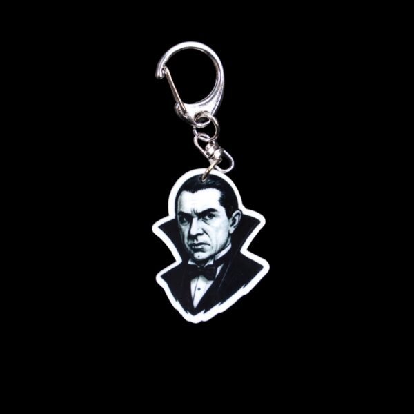 Dracula Bag Tag. This bag tag is made with acrylic and heat pressed. Comes with lobster clasp topper that easily hooks to a bag, zippers, and lanyards for fun display and swivels. White backside.