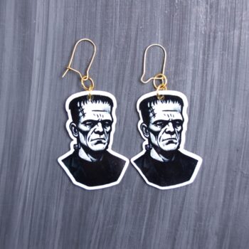 Frank Earrings. These earrings are made with acrylic and hand heat pressed. Comes with 18k plated gold hooks that is nickel free. Easily put loop through ear and hook back so the earring doesn’t fall out.