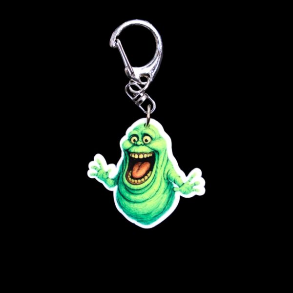 Green Ghost Bag Tag. This bag tag is made with acrylic and heat pressed. Comes with lobster clasp topper that easily hooks to a bag, zippers, and lanyards for fun display and swivels. White backside.