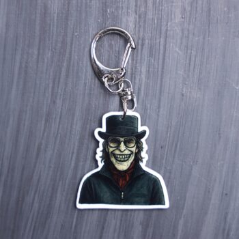 Kidnapper Bag Tag. This bag tag is made with acrylic and heat pressed. Comes with lobster clasp topper that easily hooks to a bag, zippers, and lanyards for fun display and swivels. White backside.