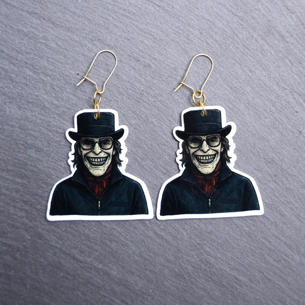 Kidnapper Earrings. These earrings are made with acrylic and hand heat pressed. Comes with 18k plated gold hooks that is nickel free. Easily put loop through ear and hook back so the earring doesn’t fall out.