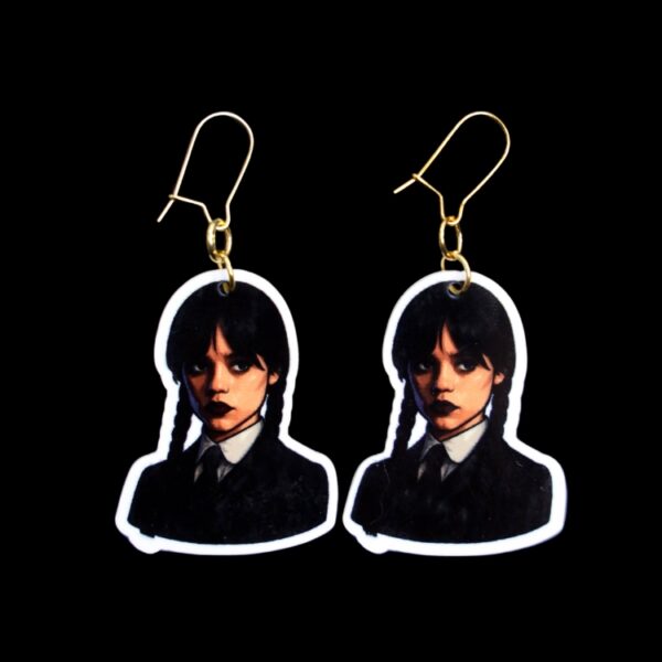 Monday's Child Earrings. These earrings are made with acrylic and hand heat pressed. Comes with 18k plated gold hooks that is nickel free. Easily put loop through ear and hook back so the earring doesn’t fall out.