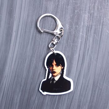 Monday's Child Bag Tag. This bag tag is made with acrylic and heat pressed. Comes with lobster clasp topper that easily hooks to a bag, zippers, and lanyards for fun display and swivels. White backside.