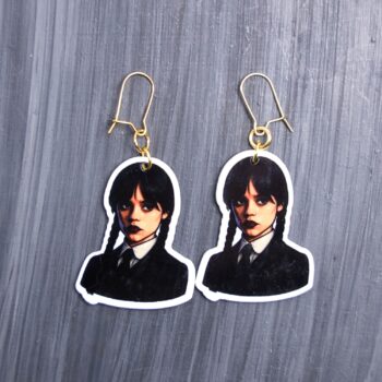 Monday's Child Earrings. These earrings are made with acrylic and hand heat pressed. Comes with 18k plated gold hooks that is nickel free. Easily put loop through ear and hook back so the earring doesn’t fall out.