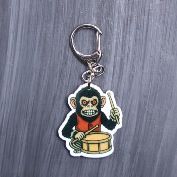 Monkey Bag Tag. This bag tag is made with acrylic and heat pressed. Comes with lobster clasp topper that easily hooks to a bag, zippers, and lanyards for fun display and swivels. White backside.