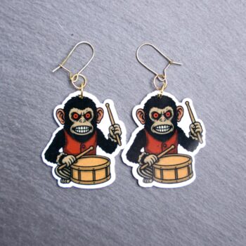 Monkey Earrings. These earrings are made with acrylic and hand heat pressed. Comes with 18k plated gold hooks that is nickel free. Easily put loop through ear and hook back so the earring doesn’t fall out.