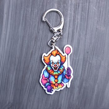 Neon Dancing Clown Bag Tag. This bag tag is made with acrylic and heat pressed. Comes with lobster clasp topper that easily hooks to a bag, zippers, and lanyards for fun display and swivels. White backside.