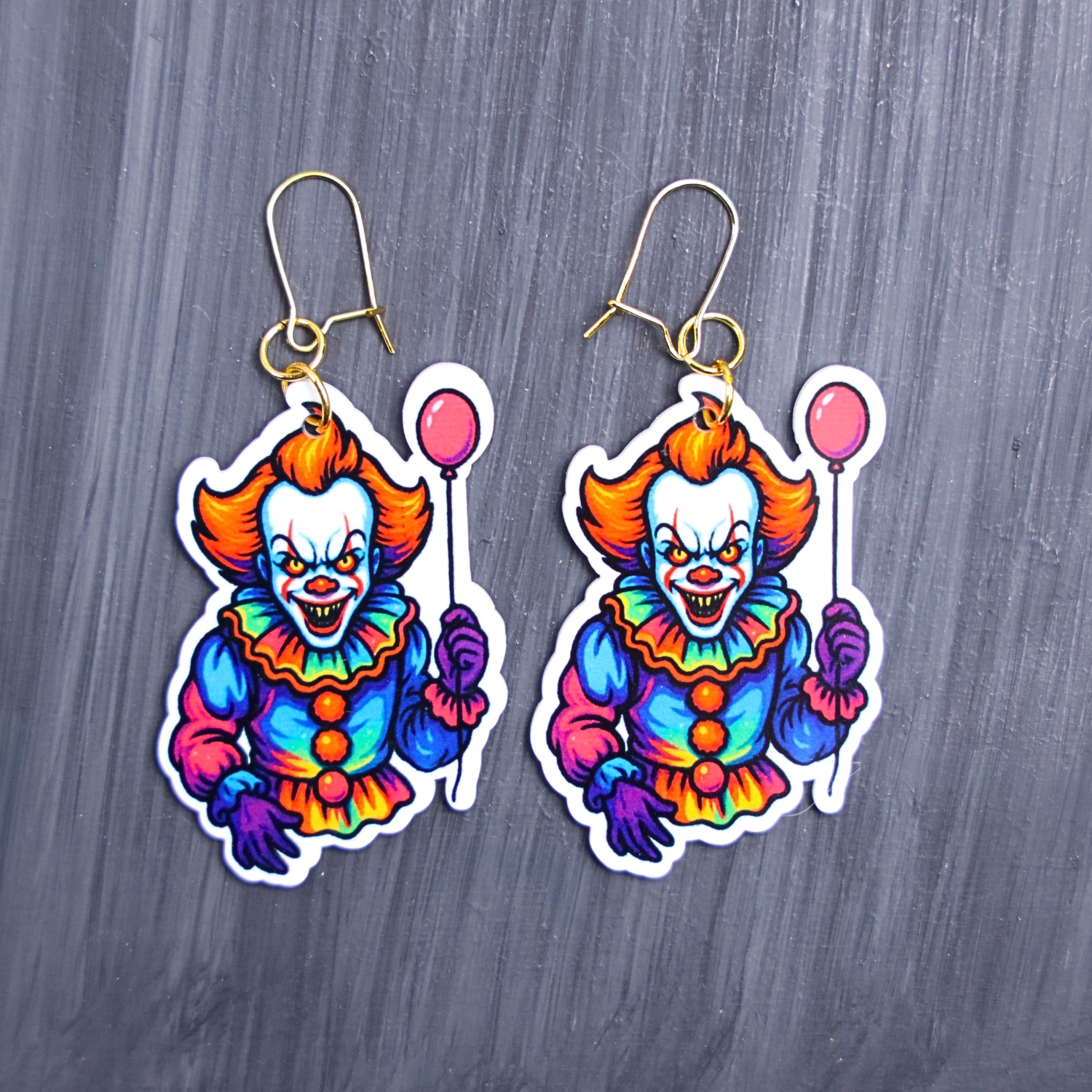 Neon Dancing Clown Earrings. These earrings are made with acrylic and hand heat pressed. Comes with 18k plated gold hooks that is nickel free. Easily put loop through ear and hook back so the earring doesn’t fall out.