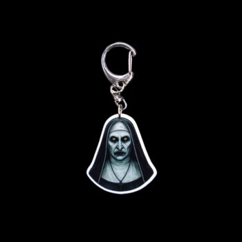 Nun Bag Tag. This bag tag is made with acrylic and heat pressed. Comes with lobster clasp topper that easily hooks to a bag, zippers, and lanyards for fun display and swivels. White backside.