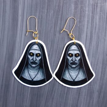 Nun Earrings. These earrings are made with acrylic and hand heat pressed. Comes with 18k plated gold hooks that is nickel free. Easily put loop through ear and hook back so the earring doesn’t fall out.