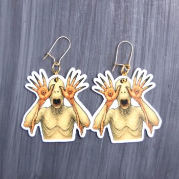 Pale One Earrings. These earrings are made with acrylic and hand heat pressed. Comes with 18k plated gold hooks that is nickel free. Easily put loop through ear and hook back so the earring doesn’t fall out.