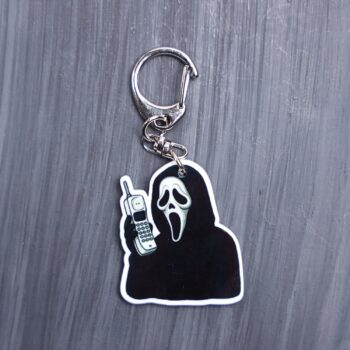 The Voice Cordless Phone Bag Tag. This bag tag is made with acrylic and heat pressed. Comes with lobster clasp topper that easily hooks to a bag, zippers, and lanyards for fun display and swivels. White backside.