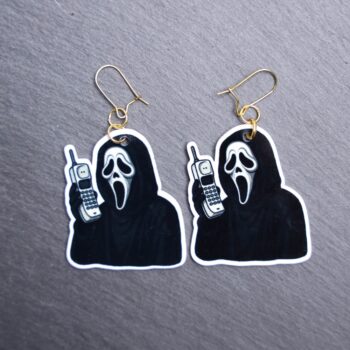 The Voice Cordless Phone Earrings. These earrings are made with acrylic and hand heat pressed. Comes with 18k plated gold hooks that is nickel free. Easily put loop through ear and hook back so the earring doesn’t fall out.