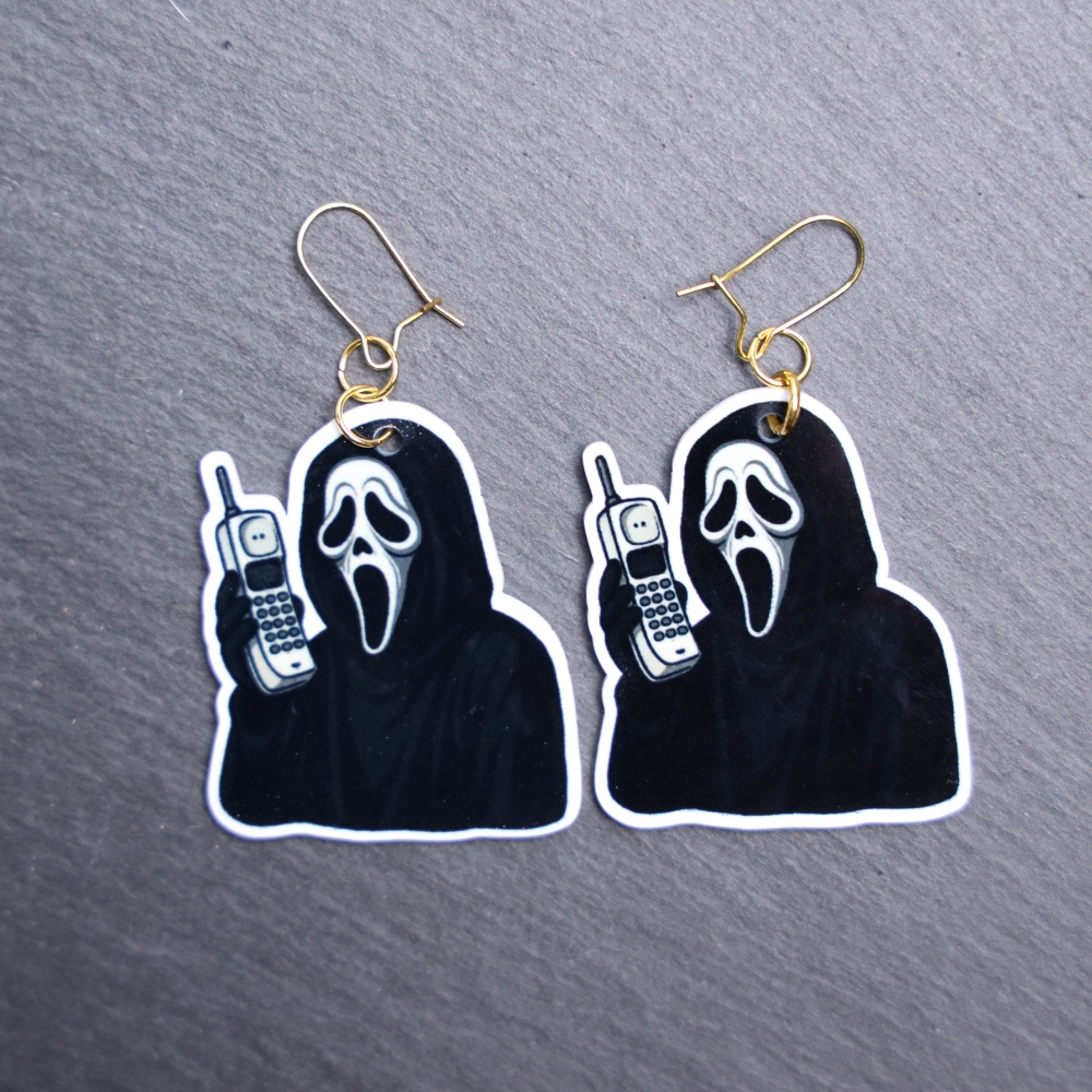 The Voice Cordless Phone Earrings. These earrings are made with acrylic and hand heat pressed. Comes with 18k plated gold hooks that is nickel free. Easily put loop through ear and hook back so the earring doesn’t fall out.