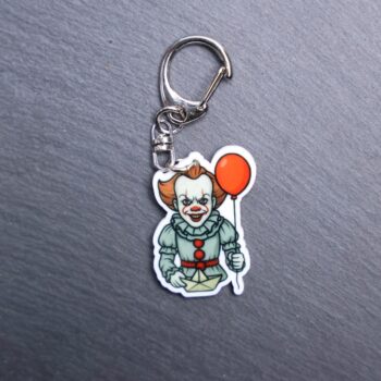 Dancing Clown Bag Tag. This bag tag is made with acrylic and heat pressed. Comes with lobster clasp topper that easily hooks to a bag, zippers, and lanyards for fun display and swivels. White backside.