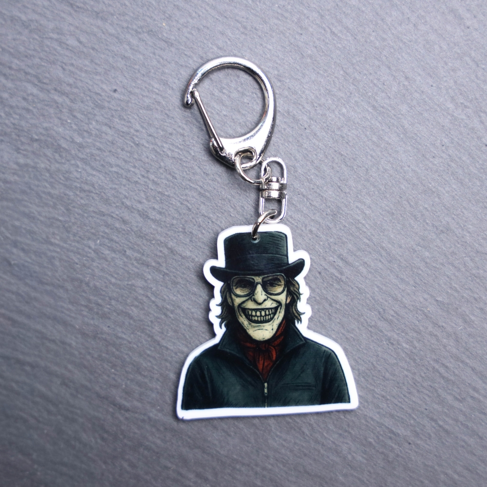 Kidnapper Bag Tag. This bag tag is made with acrylic and heat pressed. Comes with lobster clasp topper that easily hooks to a bag, zippers, and lanyards for fun display and swivels. White backside.