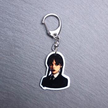 Monday's Child Bag Tag. This bag tag is made with acrylic and heat pressed. Comes with lobster clasp topper that easily hooks to a bag, zippers, and lanyards for fun display and swivels. White backside.