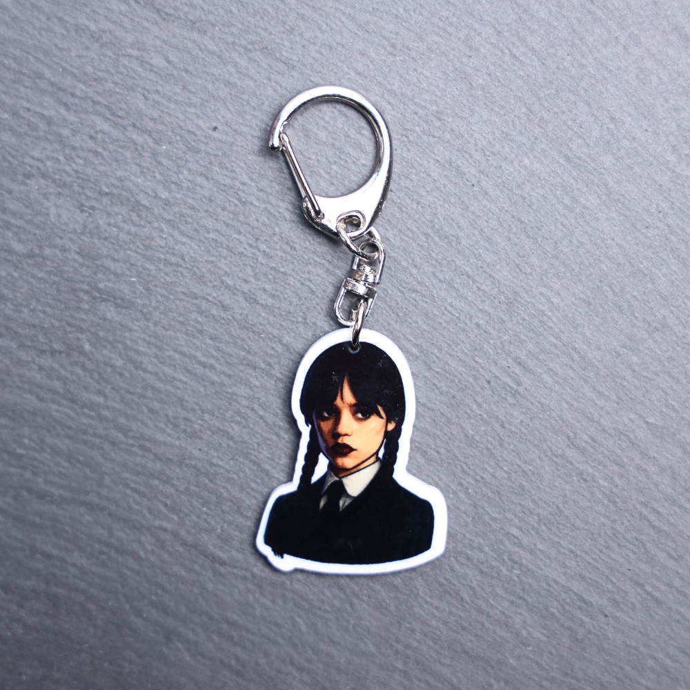 Monday's Child Bag Tag. This bag tag is made with acrylic and heat pressed. Comes with lobster clasp topper that easily hooks to a bag, zippers, and lanyards for fun display and swivels. White backside.