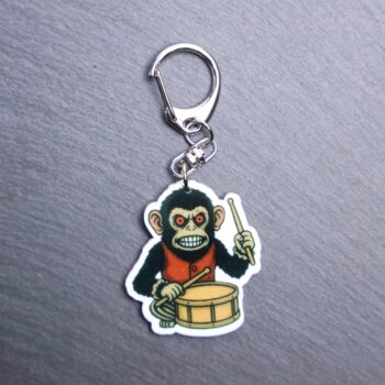 Monkey Bag Tag. This bag tag is made with acrylic and heat pressed. Comes with lobster clasp topper that easily hooks to a bag, zippers, and lanyards for fun display and swivels. White backside.