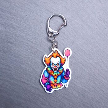 Neon Dancing Clown Bag Tag. This bag tag is made with acrylic and heat pressed. Comes with lobster clasp topper that easily hooks to a bag, zippers, and lanyards for fun display and swivels. White backside.