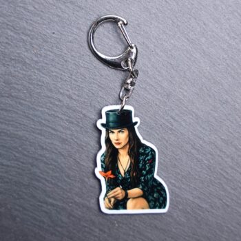 She's The Hat Bag Tag. This bag tag is made with acrylic and heat pressed. Comes with lobster clasp topper that easily hooks to a bag, zippers, and lanyards for fun display and swivels. White backside.