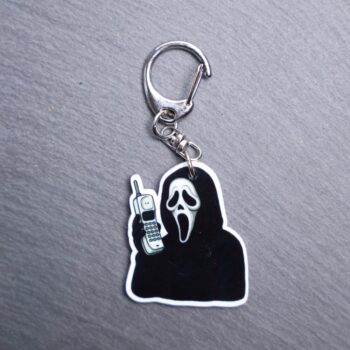 The Voice Cordless Phone Bag Tag. This bag tag is made with acrylic and heat pressed. Comes with lobster clasp topper that easily hooks to a bag, zippers, and lanyards for fun display and swivels. White backside.