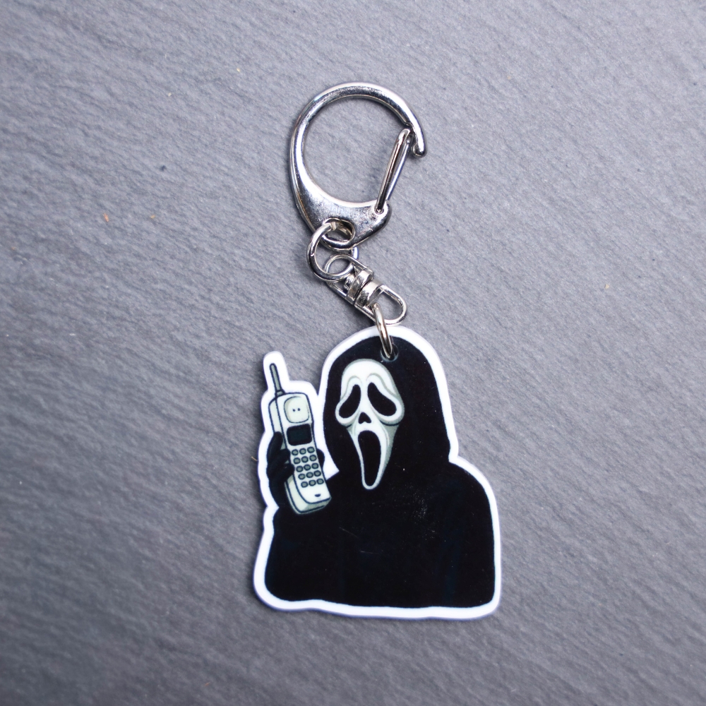 The Voice Cordless Phone Bag Tag. This bag tag is made with acrylic and heat pressed. Comes with lobster clasp topper that easily hooks to a bag, zippers, and lanyards for fun display and swivels. White backside.