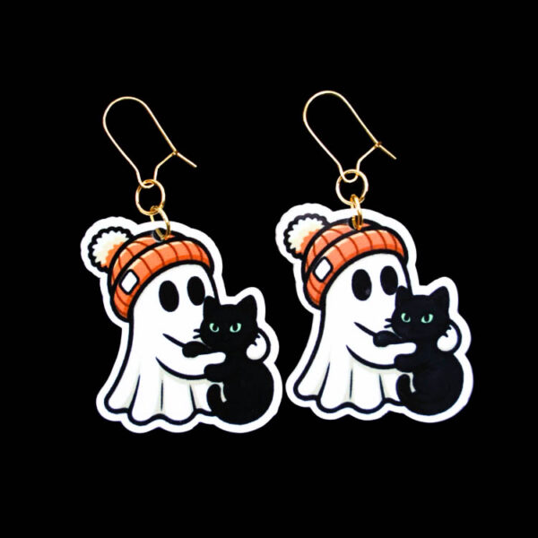 Ghost Beanie Black Cat Earrings. These earrings are made with acrylic and hand heat pressed. Comes with 18k plated gold hooks that is nickel free. Easily put loop through ear and hook back so the earring doesn’t fall out.