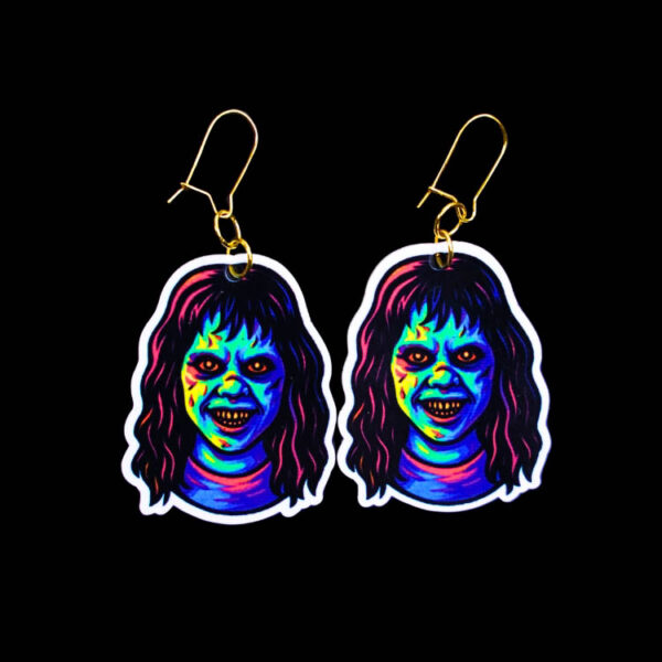 Neon Demon Girl Earrings. These earrings are made with acrylic and hand heat pressed. Comes with 18k plated gold hooks that is nickel free. Easily put loop through ear and hook back so the earring doesn’t fall out.