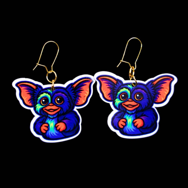 Neon Fuzzy Goblin Earrings. These earrings are made with acrylic and hand heat pressed. Comes with 18k plated gold hooks that is nickel free. Easily put loop through ear and hook back so the earring doesn’t fall out.