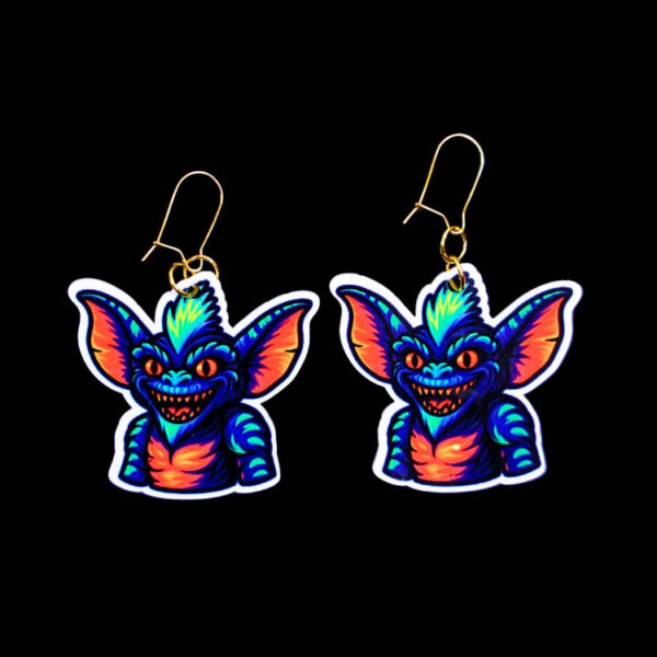 Neon Goblin Earrings. These earrings are made with acrylic and hand heat pressed. Comes with 18k plated gold hooks that is nickel free. Easily put loop through ear and hook back so the earring doesn’t fall out.