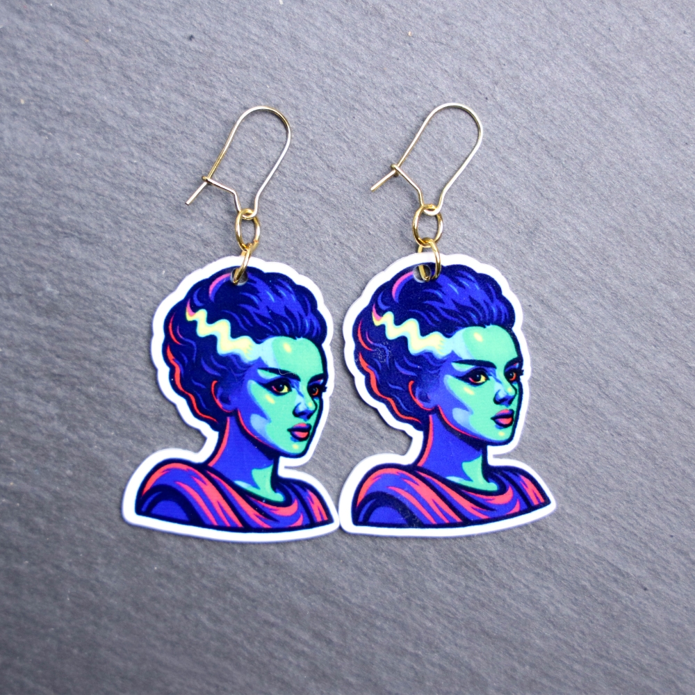 Neon Bride Earrings. These earrings are made with acrylic and hand heat pressed. Comes with 18k plated gold hooks that is nickel free. Easily put loop through ear and hook back so the earring doesn’t fall out.
