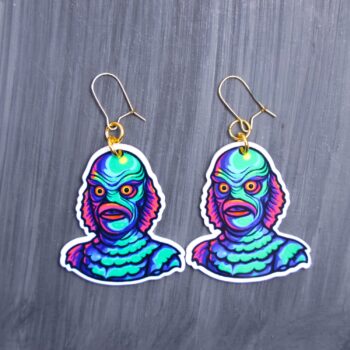 Neon Creature Earrings. These earrings are made with acrylic and hand heat pressed. Comes with 18k plated gold hooks that is nickel free. Easily put loop through ear and hook back so the earring doesn’t fall out.